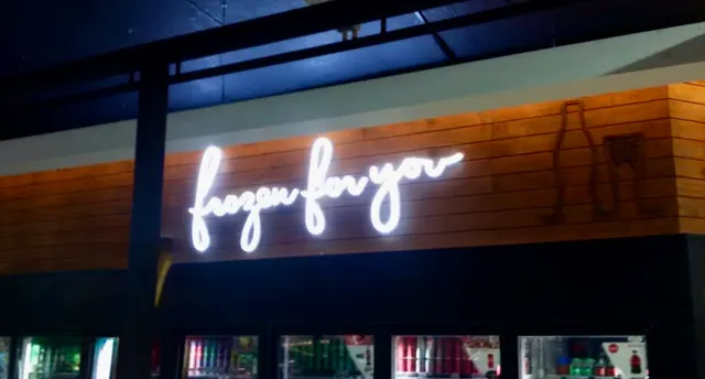 Illuminated Frozen for You lettering at Cape St Francis after dark