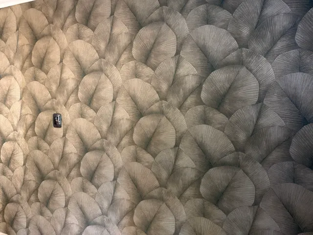 Close view of the printed botanical wallpaper pattern