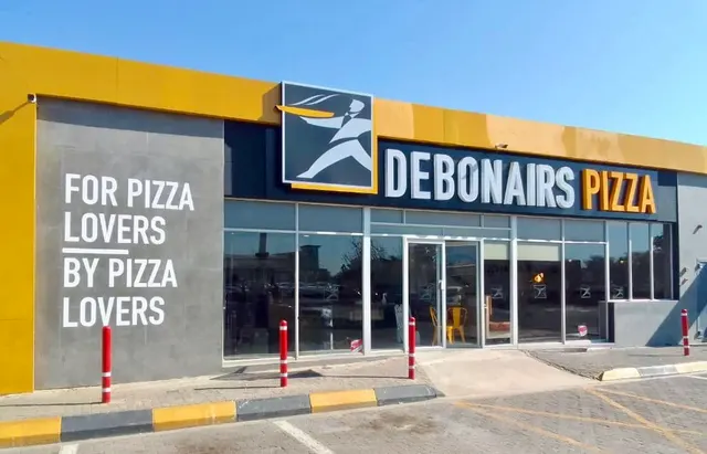 Debonairs shopfront lettering and entrance graphics at Pilane Mall