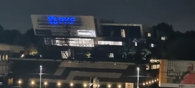 Illuminated PKF building signage at Melrose after dark