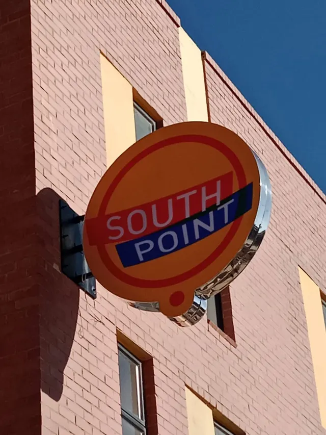 Projecting round South Point sign on the Switch On Point building