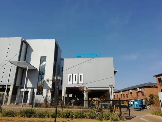 Building signage and roofline lettering for Etion