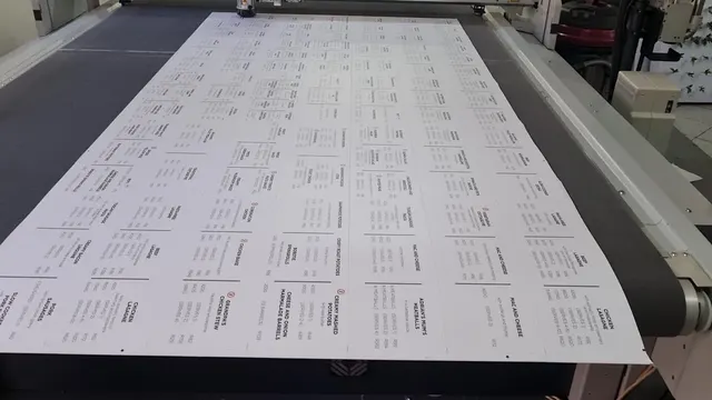 CNC cutting head working across a printed sheet of Frozen for You price boards