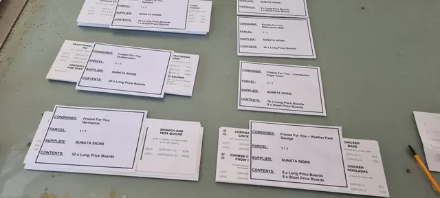 Individual Frozen for You price boards laid out after cutting